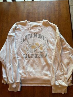 American Eagle Outfitters White Sweatshirt with Yellow Floral Graphic